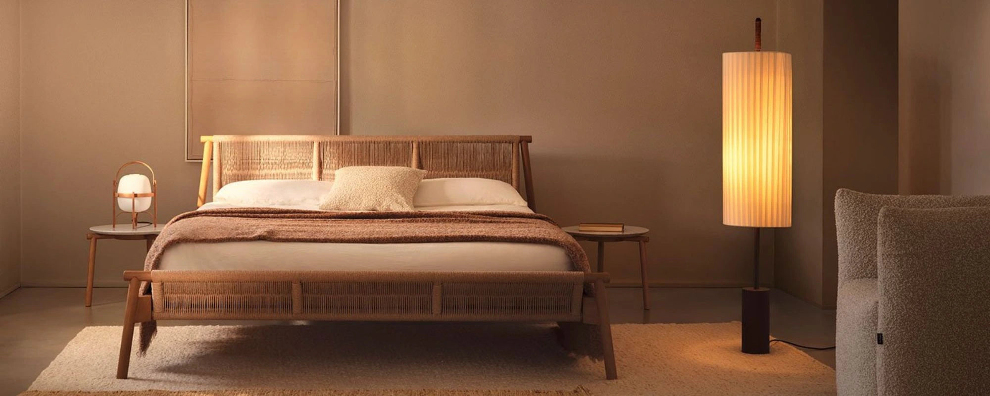Wooden bed in a bedroom with soft lighting and decor